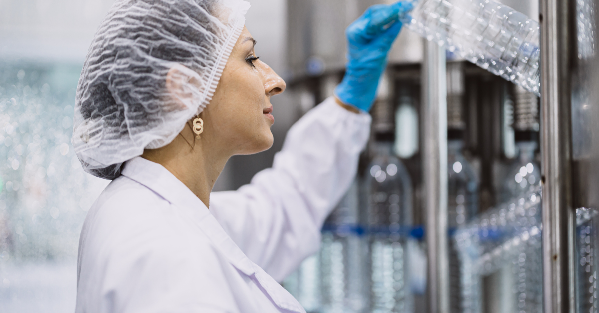 Woman in lab wearing hairnet 